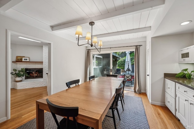 90 Corte Placida, Greenbrae, CA 94904 - dining room with beam ceiling, light wood-style flooring, wood ceiling, baseboards, and a chandelier