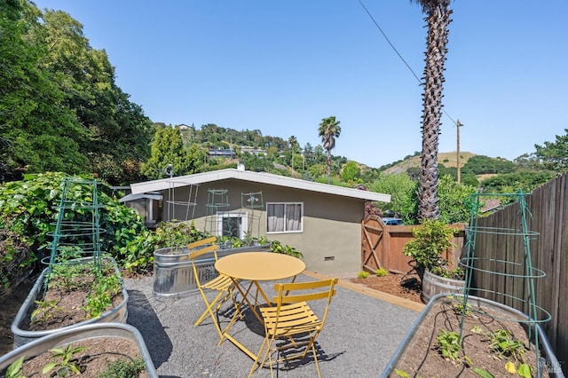 90 Corte Placida, Greenbrae, CA 94904 - back of property with a garden, fence, and a patio