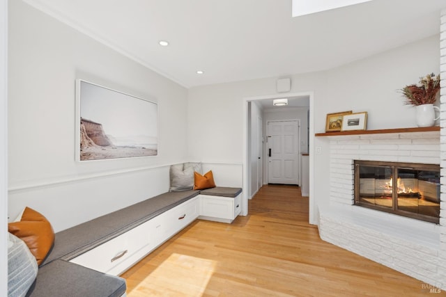 90 Corte Placida, Greenbrae, CA 94904 - living area featuring a brick fireplace, light wood-style floors, and recessed lighting