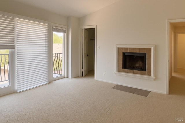 935 Hunt Ave, Saint Helena, CA 94574 - unfurnished living room featuring carpet floors, healthy amount of natural light, lofted ceiling, and a tile fireplace