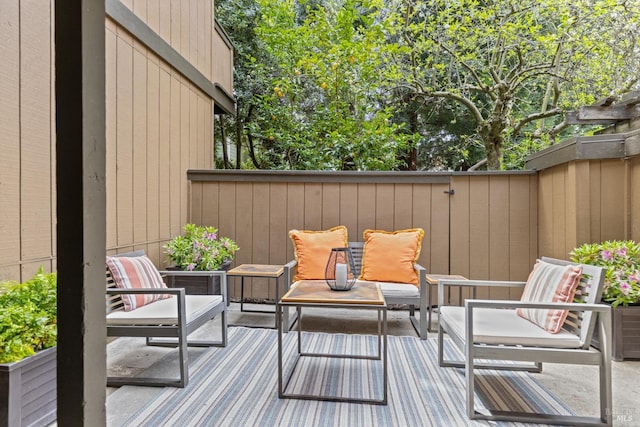 view of patio / terrace with fence and an outdoor living space