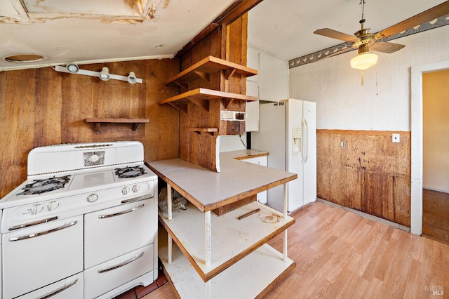 735 Robinson Rd, Sebastopol, CA 95472 - kitchen featuring light wood finished floors, wood walls, open shelves, white fridge with ice dispenser, and ceiling fan