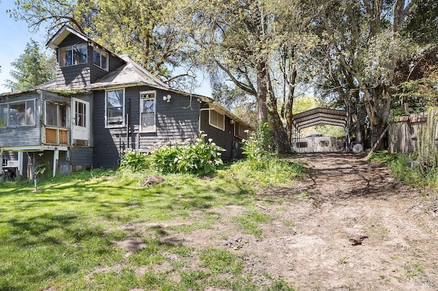 735 Robinson Rd, Sebastopol, CA 95472 - exterior space with a carport, driveway, fence, and a sunroom