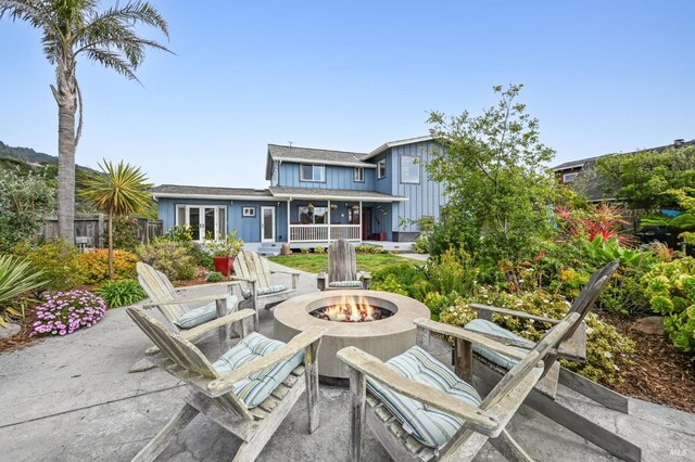 1 Joaquin Patio, Stinson Beach, CA 94970 - view of patio / terrace featuring a fire pit, fence, and french doors