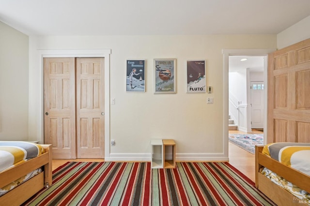 1 Joaquin Patio, Stinson Beach, CA 94970 - bedroom featuring baseboards, wood finished floors, and a closet