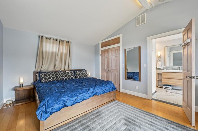 1 Joaquin Patio, Stinson Beach, CA 94970 - bedroom featuring baseboards, lofted ceiling with beams, wood finished floors, and visible vents