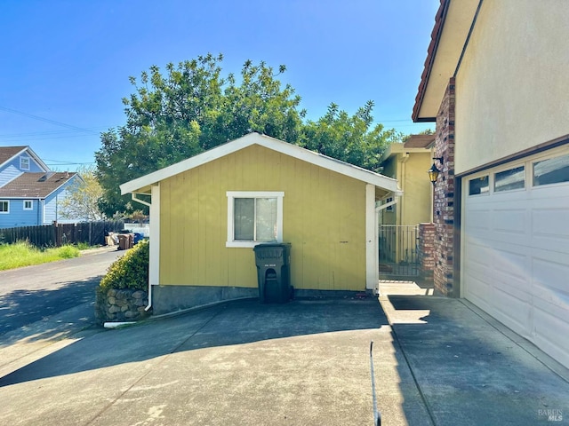 639 E 5th St, Benicia, CA 94510 - garage with concrete driveway and fence