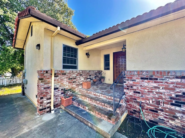 639 E 5th St, Benicia, CA 94510 - entrance to property featuring stucco siding and fence