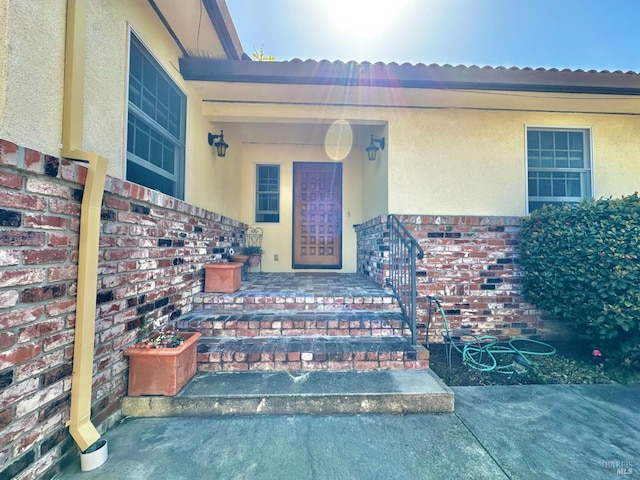 639 E 5th St, Benicia, CA 94510 - doorway to property with stucco siding and brick siding