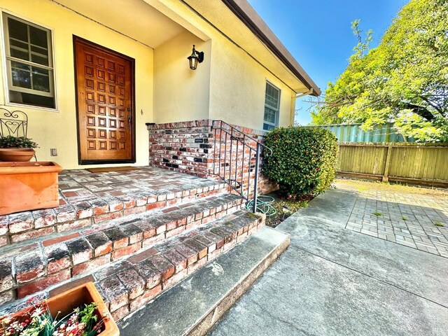 639 E 5th St, Benicia, CA 94510 - view of front of house with concrete driveway, a garage, stucco siding, and a tiled roof