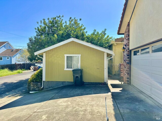 639 E 5th St, Benicia, CA 94510 - kitchen with dishwasher, tile countertops, a peninsula, light tile patterned flooring, and open floor plan