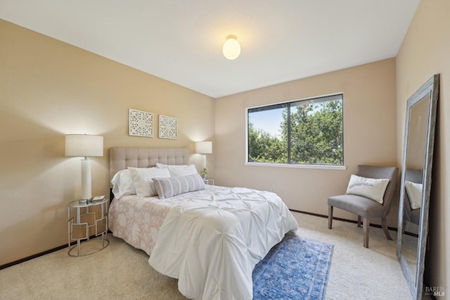 carpeted bedroom with baseboards