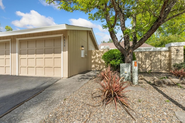 view of side of property with fence