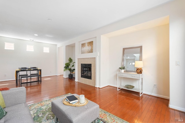 1606 Chamberlain Dr, Fairfield, CA 94533 - living room featuring a tiled fireplace, baseboards, and wood-type flooring