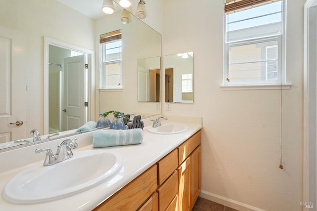 1606 Chamberlain Dr, Fairfield, CA 94533 - full bathroom with baseboards, tile patterned floors, double vanity, and a sink