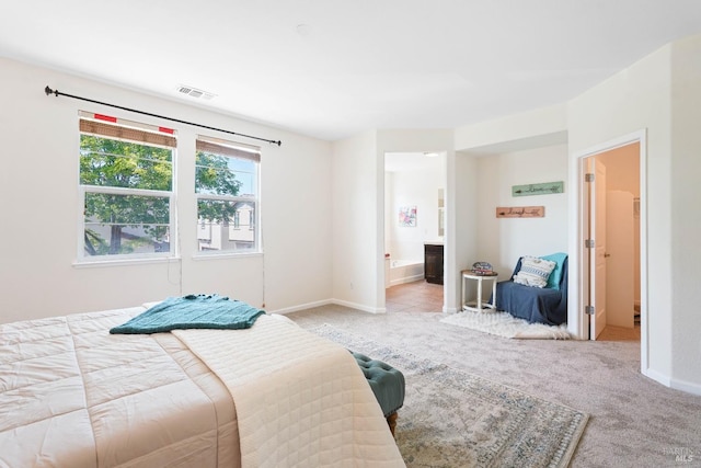 1606 Chamberlain Dr, Fairfield, CA 94533 - bedroom with light colored carpet, visible vents, ensuite bathroom, and baseboards