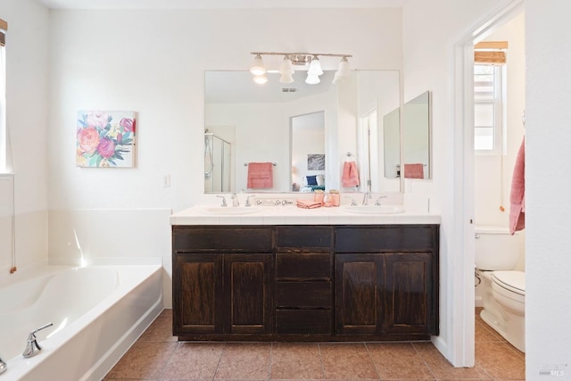 1606 Chamberlain Dr, Fairfield, CA 94533 - full bathroom with double vanity, toilet, a bath, and a sink