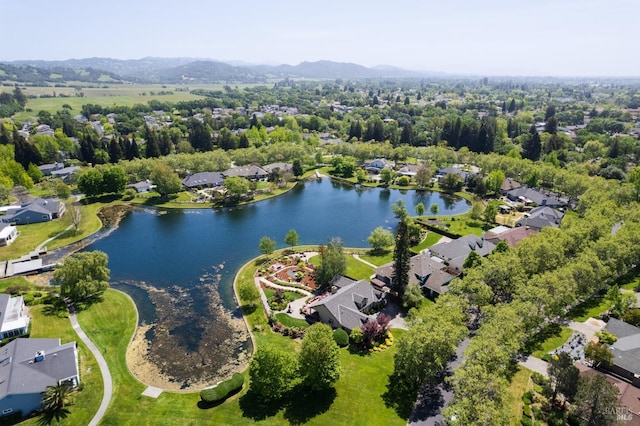 birds eye view of property featuring a residential view and a water and mountain view