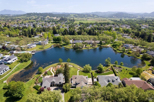 bird's eye view featuring a water and mountain view and a residential view