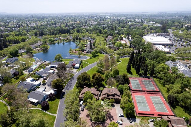 drone / aerial view featuring a water view and a residential view