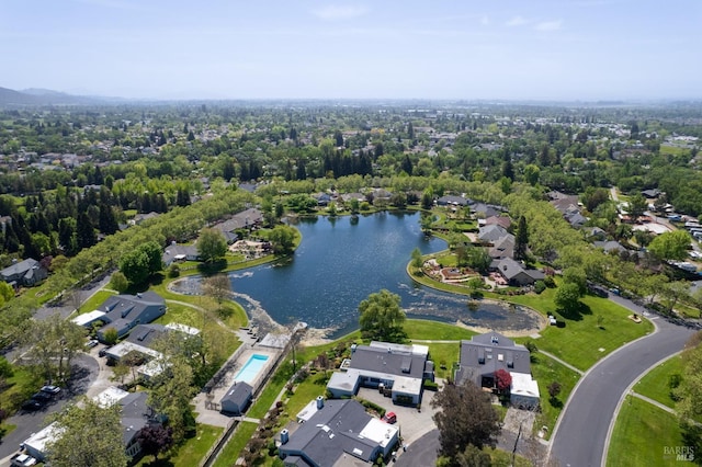birds eye view of property with a water view and a residential view