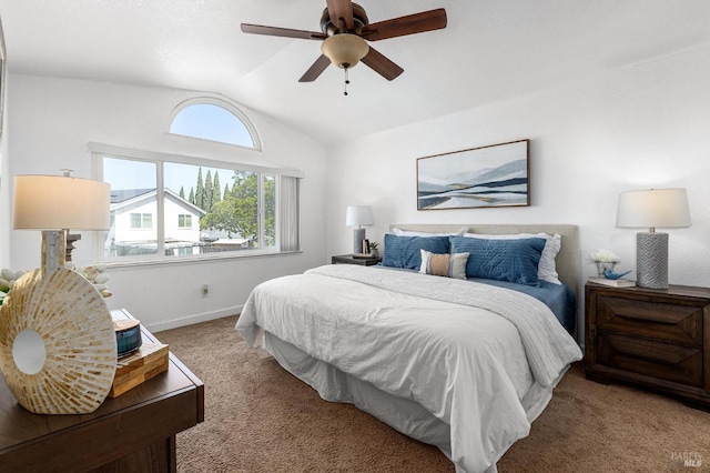 carpeted bedroom with ceiling fan, lofted ceiling, and baseboards