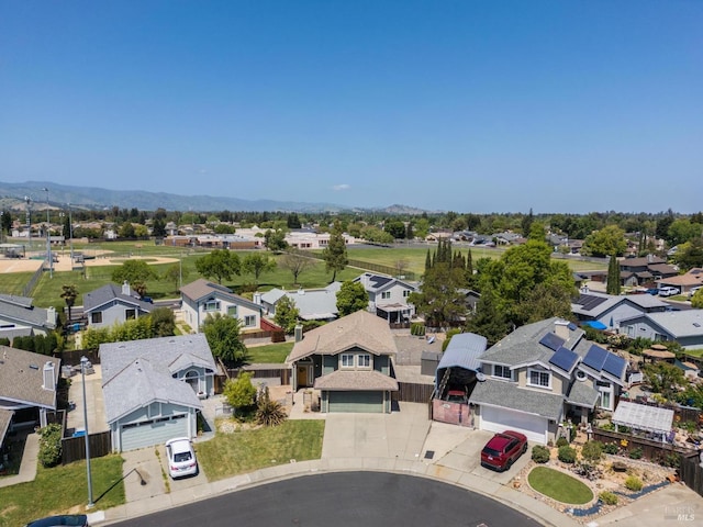 birds eye view of property with a residential view and a mountain view