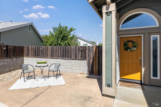 view of patio / terrace featuring fence
