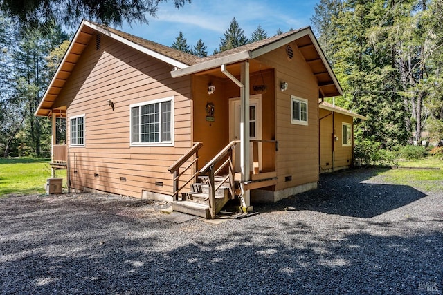 view of front of home featuring crawl space
