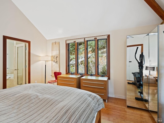 bedroom with high vaulted ceiling, baseboards, and light wood-style floors
