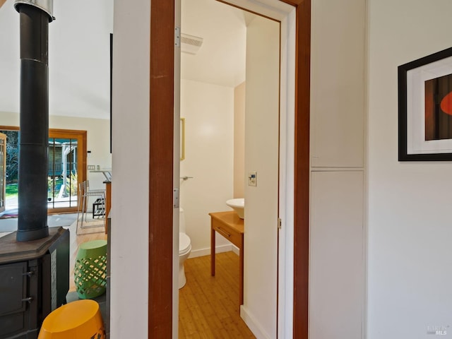 corridor with light wood-style floors