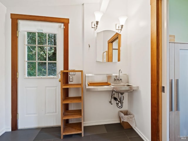 bathroom featuring tile patterned flooring and baseboards