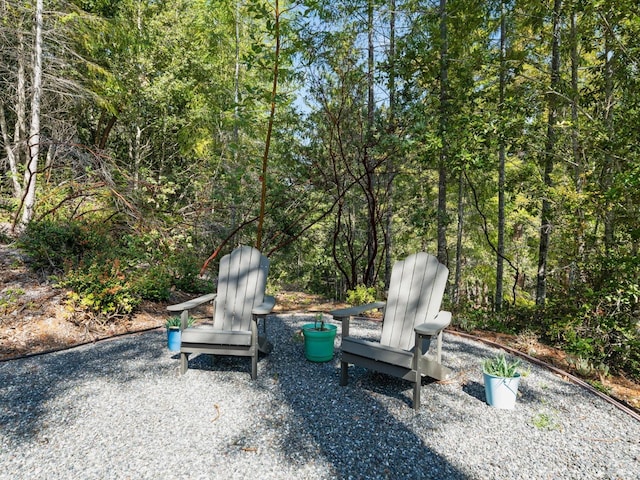 view of patio / terrace with a view of trees