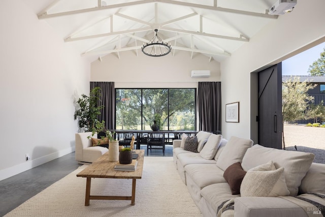living area with high vaulted ceiling, baseboards, a wall mounted air conditioner, and a notable chandelier