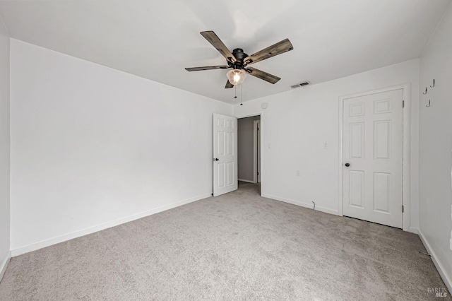 unfurnished bedroom with a ceiling fan, visible vents, carpet floors, and baseboards