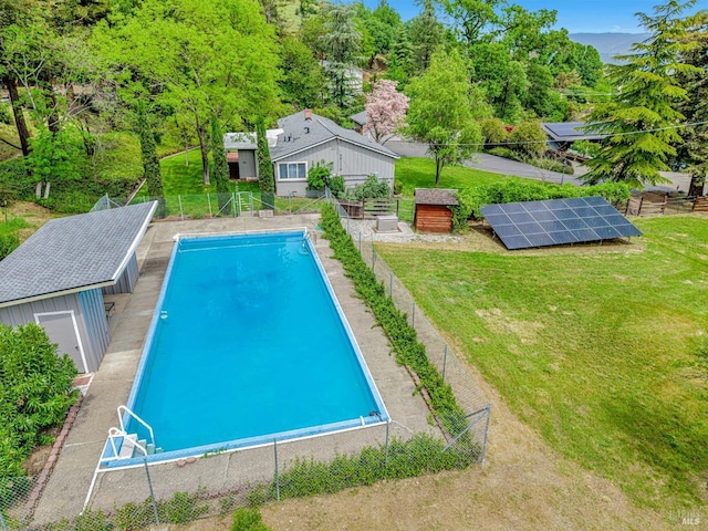 view of pool with a lawn, a fenced in pool, and fence