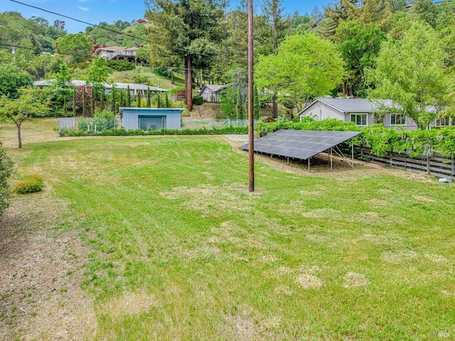 view of yard featuring a pool and fence