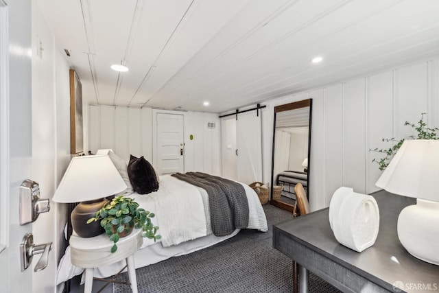 22 Wood St, San Francisco, CA 94118 - bedroom with a decorative wall, carpet, a barn door, and recessed lighting
