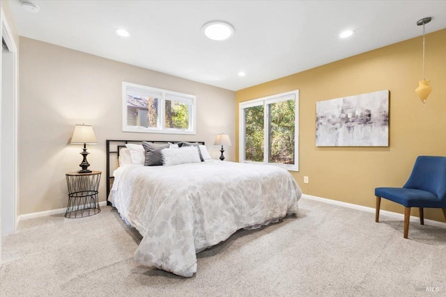 carpeted bedroom featuring recessed lighting and baseboards