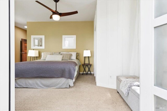 carpeted bedroom with ceiling fan