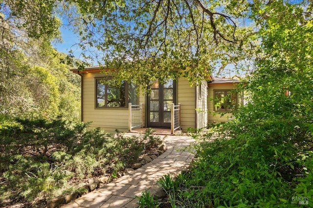obstructed view of property featuring french doors