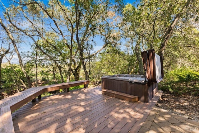 wooden terrace featuring a hot tub