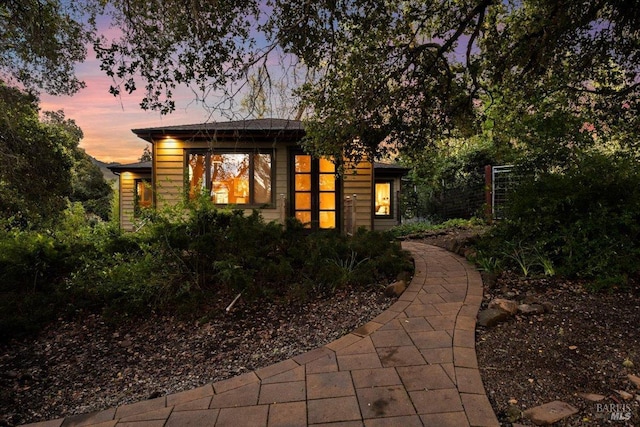 view of property exterior at dusk