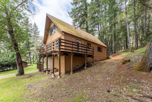 back of house featuring a deck