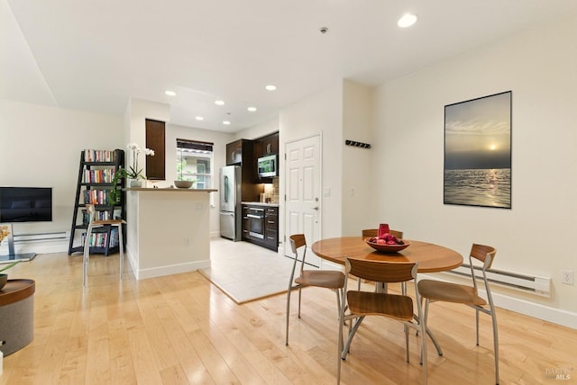401 N Ave Unit 310, San Rafael, CA 94903 - dining room with baseboard heating, recessed lighting, baseboards, light wood-type flooring, and stacked washer and clothes dryer