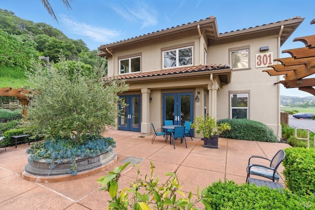 401 N Ave Unit 310, San Rafael, CA 94903 - back of house featuring a tiled roof, french doors, a patio area, and stucco siding