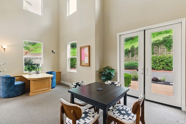 401 N Ave Unit 310, San Rafael, CA 94903 - dining area with light colored carpet, baseboards, and a high ceiling