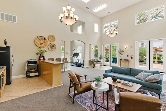 401 N Ave Unit 310, San Rafael, CA 94903 - living area featuring arched walkways, an inviting chandelier, a healthy amount of sunlight, and visible vents
