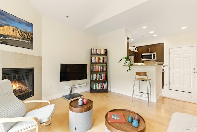 401 N Ave Unit 310, San Rafael, CA 94903 - sitting room featuring a fireplace, a ceiling fan, vaulted ceiling, and wood finished floors