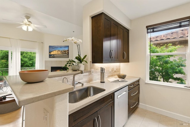 401 N Ave Unit 310, San Rafael, CA 94903 - kitchen featuring decorative backsplash, light tile patterned flooring, dark brown cabinets, light countertops, and stainless steel appliances